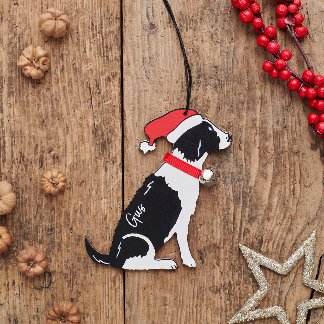 Personalised Black & White Springer Spaniel Christmas decoration with name — wooden dog decoration with Father Christmas hat and jingle bell collar, thoughtful dog lover gift by Sweet William Designs