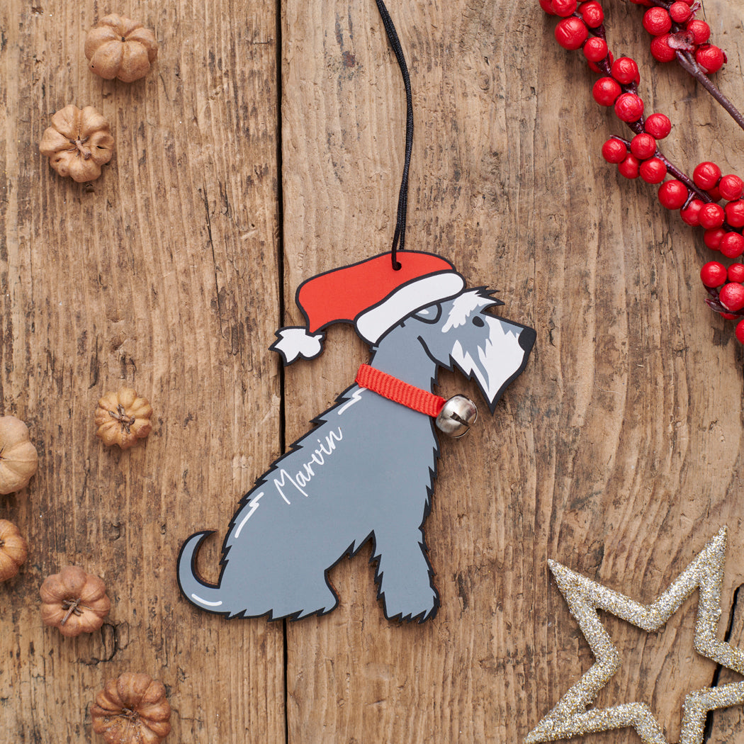 Personalised Grey Schnauzer Christmas decoration with name — wooden dog decoration with Father Christmas hat and jingle bell collar, thoughtful dog lover gift by Sweet William Designs