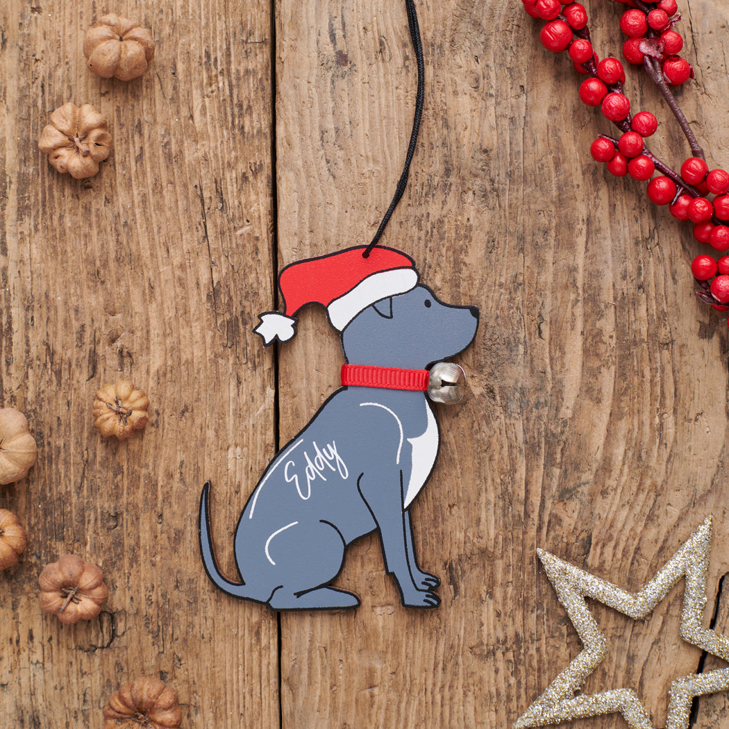 Personalised Staffie Christmas decoration with name — wooden dog decoration with Father Christmas hat and jingle bell collar, thoughtful dog lover gift by Sweet William Designs