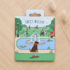 Chocolate Labrador enamel dog pin on Sweet William Designs park scene backing card — thoughtful gift for Chocolate Labrador lovers