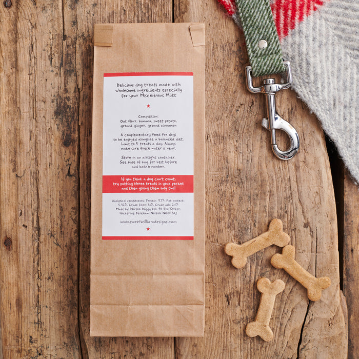 Reverse of Gingerbread Dog Treats bag showing ingredients — handmade with oat flour, banana, sweet potato, ginger and cinnamon, by Sweet William Designs