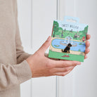Black Cockapoo / Labradoodle enamel dog pin held in hands on illustrated park backing card — gold-plated dog lover gift by Sweet William Designs