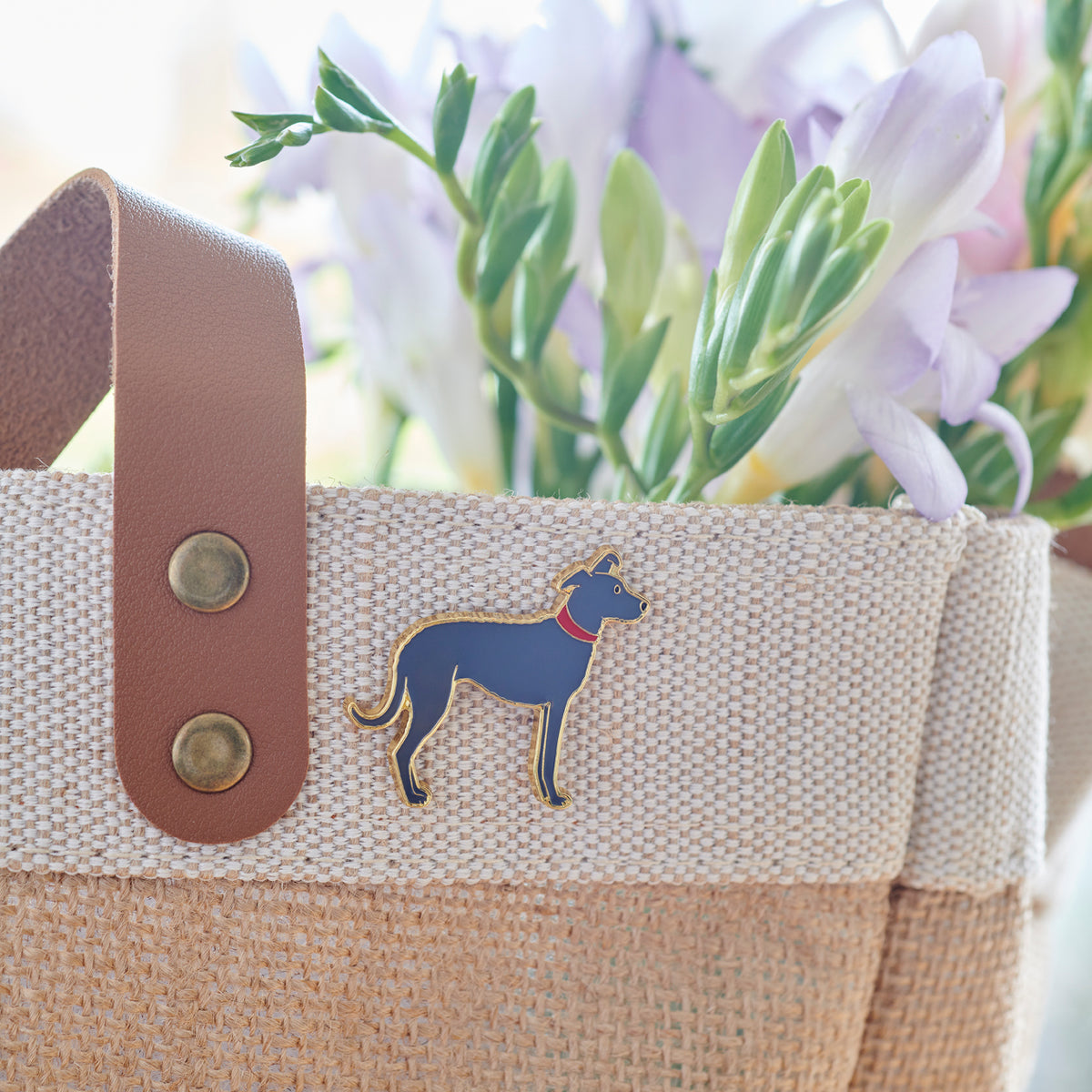 Lurcher enamel pin styled on our jute bag, a thoughtful gift for Lurcher lovers by Sweet William Designs