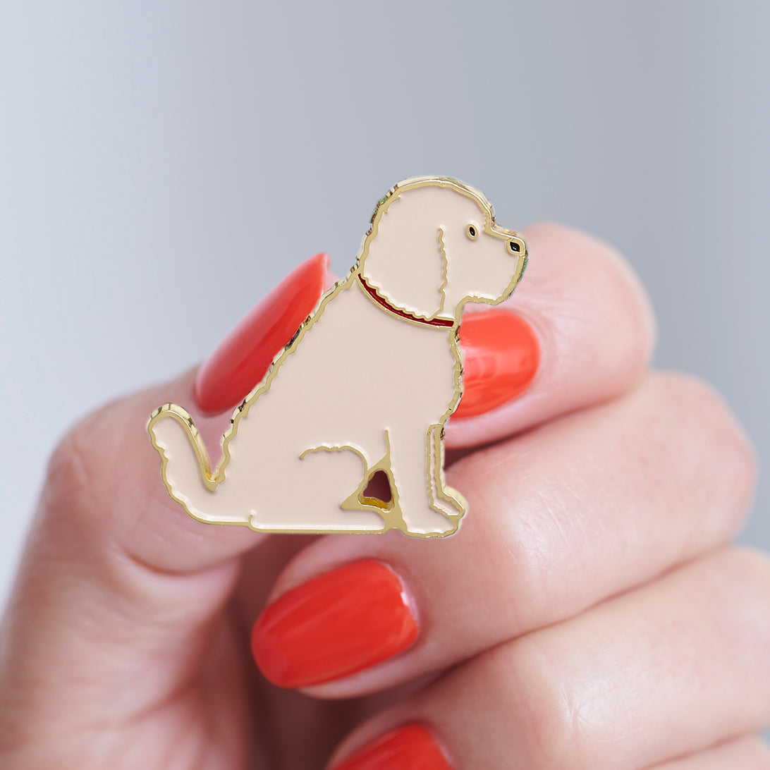 Close-up of Apricot Cockapoo / Labradoodle enamel pin held in hand, showing the detailed Cockapoo / Labradoodle dog design by Sweet William Designs 