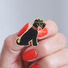Close-up of a Black Schnauzer enamel pin held in hand, showing the detailed Schnauzer illustration by Sweet William Designs 