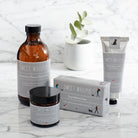 Dog Walkers Revival Collection arranged on a marble surface featuring hand cream, bath foam, soap and foot cream — thoughtful dog walker gift by Sweet William Designs