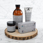 Dog Walkers Revival Collection displayed on a round wooden board, including hand cream, bath foam, soap and foot cream — dog lover gift by Sweet William Designs