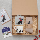Black Cocker Spaniel Christmas gift hamper with a matching Black Cocker Spaniel Christmas pin, socks, mug, Christmas decoration and greeting card by Sweet William Designs