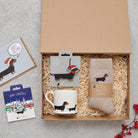 Dachshund Christmas gift hamper featuring decoration, mug, socks and greeting cards — thoughtful dog lover gift set by Sweet William Designs