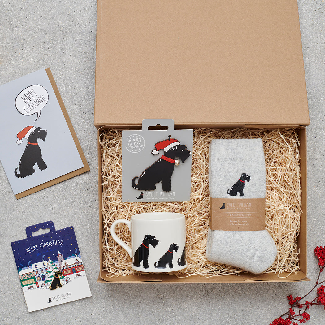 Black Schnauzer Christmas gift hamper with a matching Black Schnauzer Christmas pin, socks, mug, Christmas decoration and greeting card by Sweet William Designs