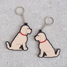 Apricot Cockapoo / Labradoodle keyring showing both sides — double-sided PVC design with Sweet William's classic illustration
