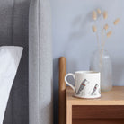 Husky mug on bedside table — ceramic dog lover gift by Sweet William Designs