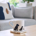 Sweet William Black Cockapoo Mug on a coffee table — illustrated Cockapoo repeat pattern ceramic mug