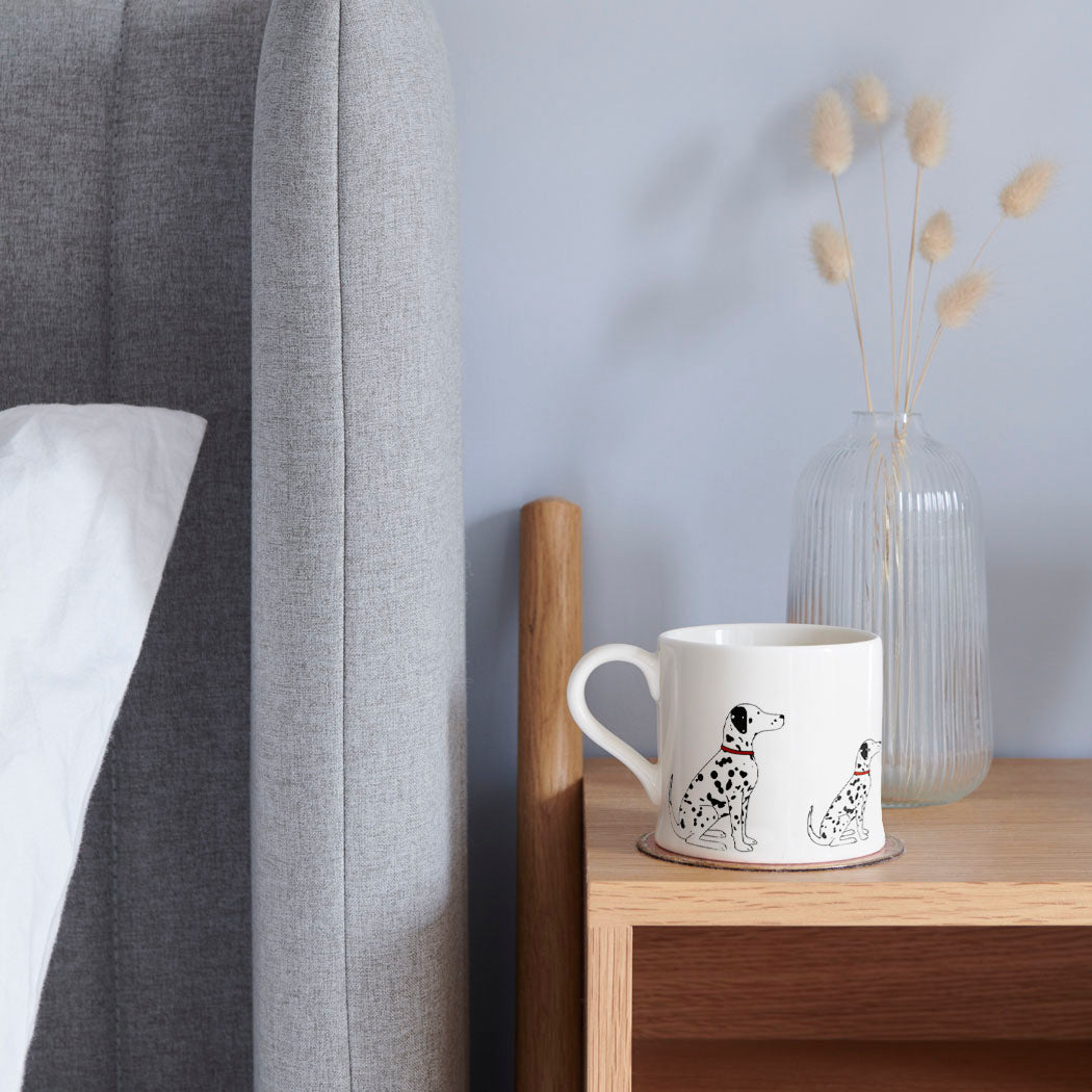 Sweet William Dalmatian Mug on a bedside table — Dalmatian dog lover gift mug