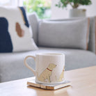 Sweet William Golden Retriever Mug on a coffee table — illustrated Golden Retriever repeat pattern ceramic mug