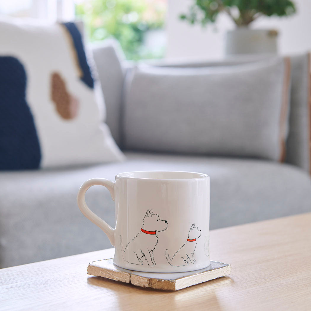 Westie mug on a coffee table — ceramic dog lover gift by Sweet William Designs