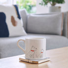 Westie mug on a coffee table — ceramic dog lover gift by Sweet William Designs