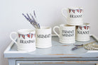 Group of ceramic Grandparent mugs arranged as thoughtful Mother’s Day gifts, featuring hand-drawn Union Jack bunting