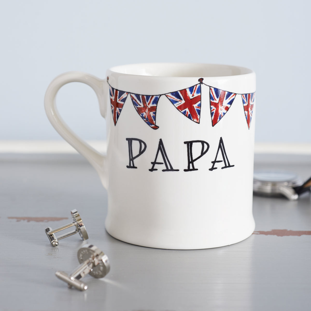 Ceramic Papa mug featuring hand-drawn Union Jack bunting, with cufflinks beside it as a thoughtful gift for him