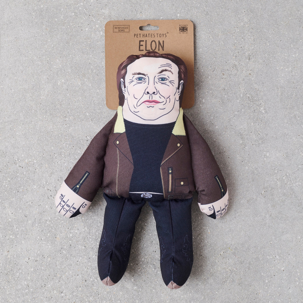 Elon Musk parody dog toy in brown aviator jacket — funny squeaky dog toy, political satire gift for dog lovers