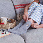 Apricot Cockapoo Labradoodle wool socks worn relaxing – cosy dog lover gift