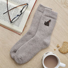 Tabby cat embroidered wool socks laid flat with book, glasses and cup of tea — cosy cat lover gift by Sweet William Designs