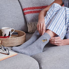 Border Terrier wool socks worn relaxing – cosy dog lover gift