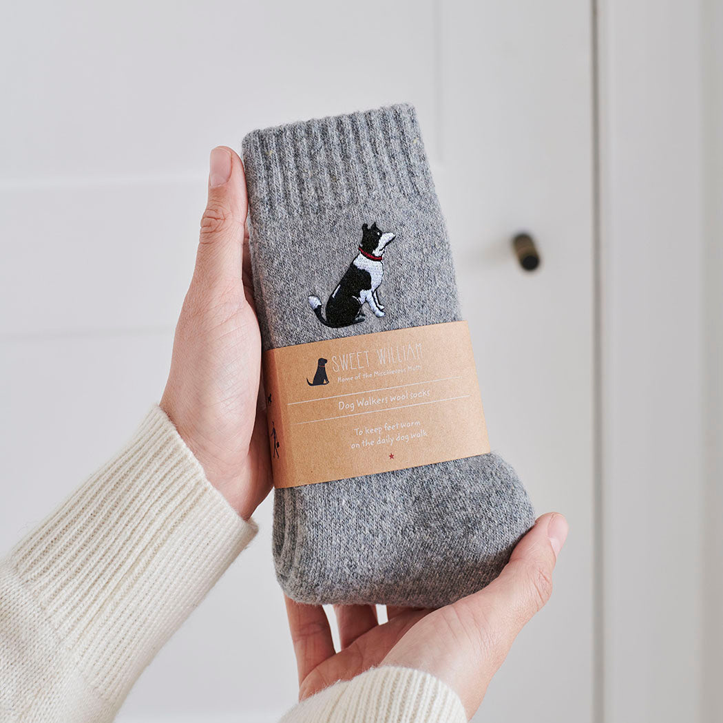 Border Collie socks in hand – embroidered wool dog lover gift