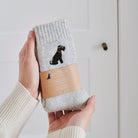 Black Schnauzer embroidered socks held in hand — soft wool blend dog lover gift by Sweet William Designs