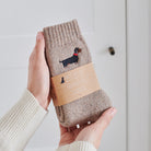 Daxie embroidered socks held in hand — soft wool blend dog lover gift by Sweet William Designs