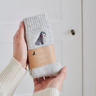 Grey Schnauzer embroidered socks held in hand — soft wool blend dog lover gift by Sweet William Designs