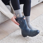 Apricot Cockapoo Labradoodle dog walking socks worn with wellies 
