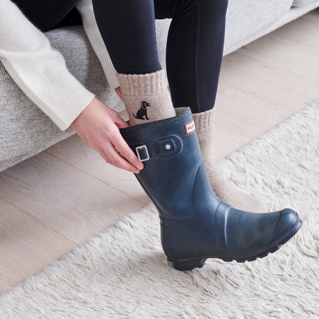 Black Cocker Spaniel dog walking socks worn with wellies — perfect gift for dog walkers and countryside lovers