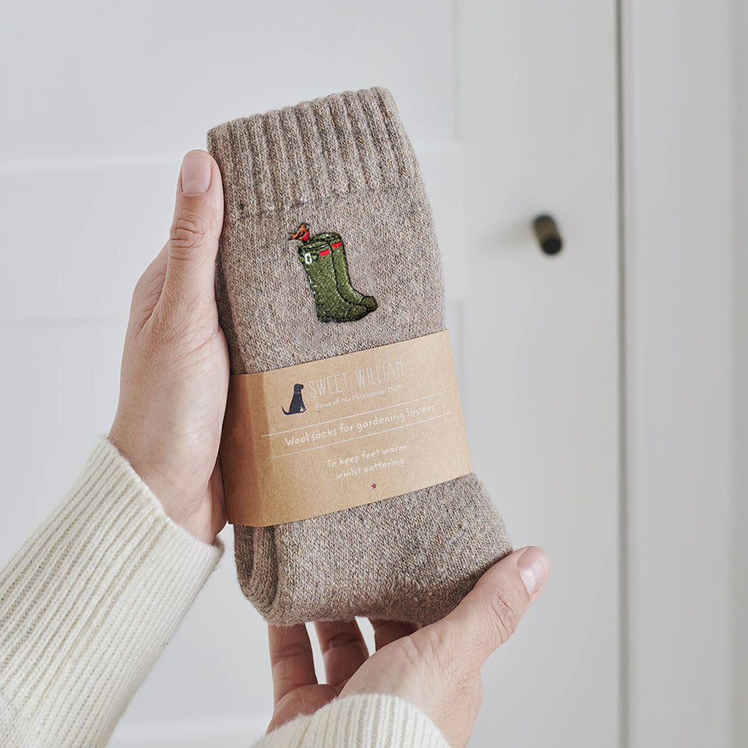 Wellies gardening socks held in hand — soft taupe marl wool blend with embroidered green wellies and robin design, gardening gift by Sweet William Designs
