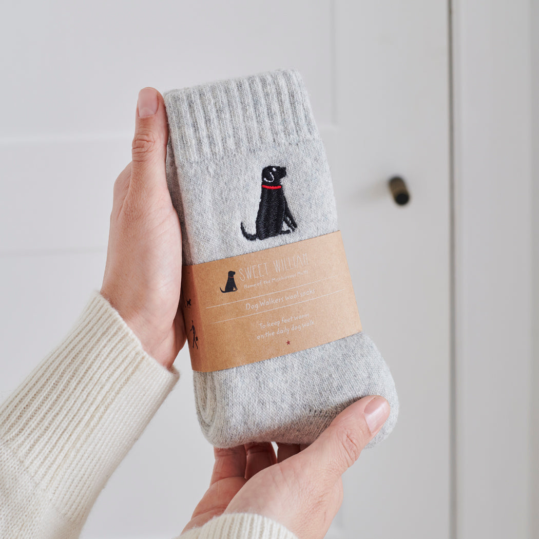  Black Labrador socks in hand – embroidered wool dog lover gift