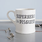 Ceramic “Superhero in Disguise” mug styled with silver cufflinks by Sweet William Designs