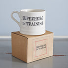 “Superhero in Training” mug presented on its kraft gift box, a perfect gift for a real-life superhero