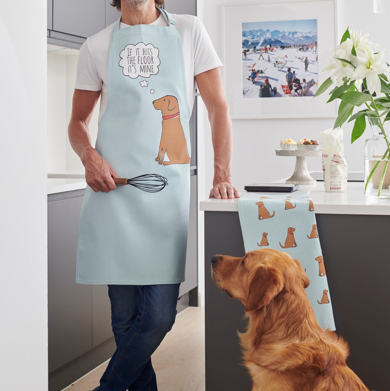 Fox Red Labrador apron and matching tea towel styled in a kitchen setting, showcasing the coordinating set by Sweet William Designs