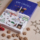Christmas Dog Treat Advent Calendar pictured alongside natural star-shaped dog treats used for the daily countdown, by Sweet William Designs