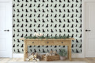 Sweet William Designs Black Labrador wallpaper in hallway — illustrated pattern styled with Christmas décor