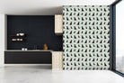 Sweet William Designs Black Labrador wallpaper in contemporary kitchen — hand-illustrated repeat pattern