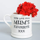 Ceramic Mum’s Favourite mug showing the “With Love From Mum’s Favourite xxx” message, styled with bright red flowers