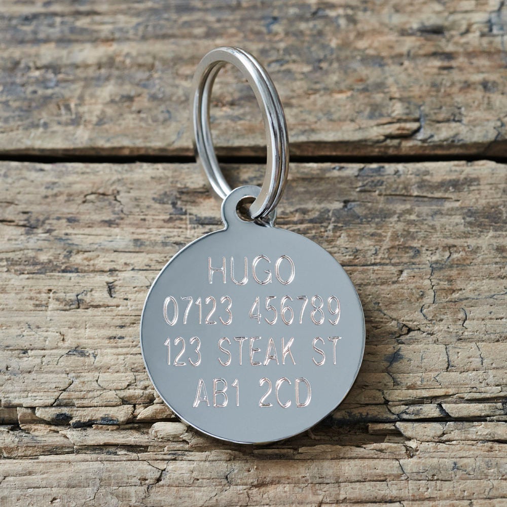 Reverse side of personalised dog ID tag — engraved with dog’s name, address and postcode, made from solid silver-plated brass by Sweet William Designs