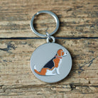 Close-up of Beagle dog ID tag — silver-plated brass with illustrated Beagle design, personalised dog tag by Sweet William Designs