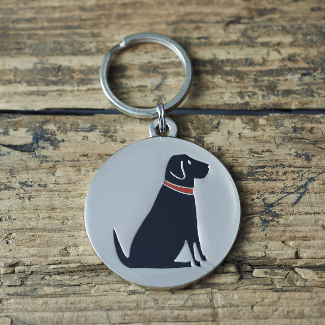 Close-up of Black Labrador dog ID tag — silver-plated brass with illustrated Black Lab design, personalised dog tag by Sweet William Designs