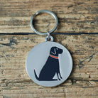 Close-up of Black Labrador dog ID tag — silver-plated brass with illustrated Black Lab design, personalised dog tag by Sweet William Designs