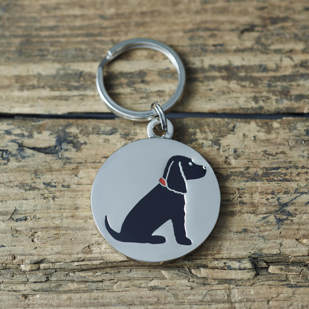 Close-up of Black Cocker Spaniel dog ID tag — silver-plated brass with illustrated Black Cocker Spaniel design, personalised dog tag by Sweet William Designs