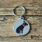 Close-up of French Bulldog dog ID tag — silver-plated brass with illustrated French Bulldog design, personalised dog tag by Sweet William Designs