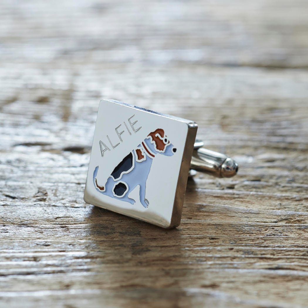 Close-up of personalised Jack Russell cufflink engraved with name on rustic wood — silver-plated gift for Jack Russell owners