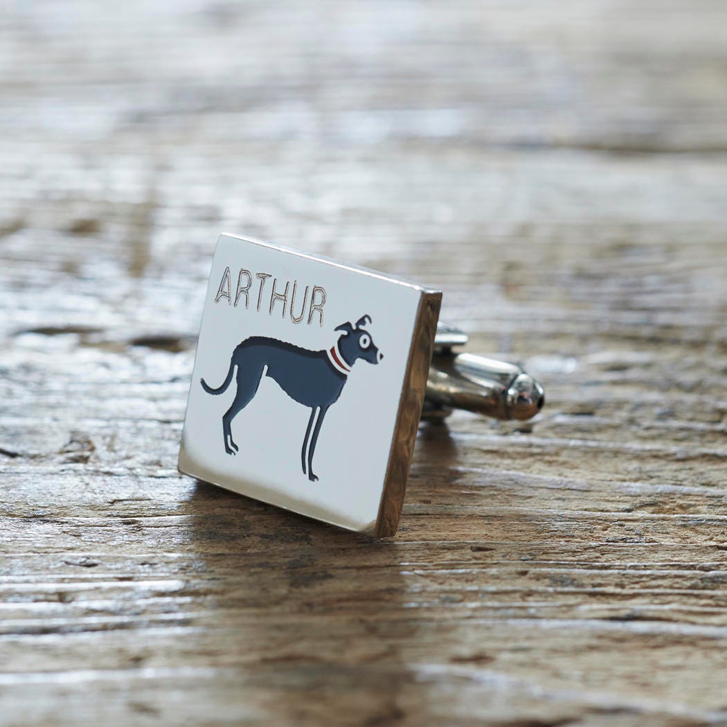 Close-up of personalised Lurcher cufflink engraved with name on rustic wood — silver-plated gift for Lurcher owners